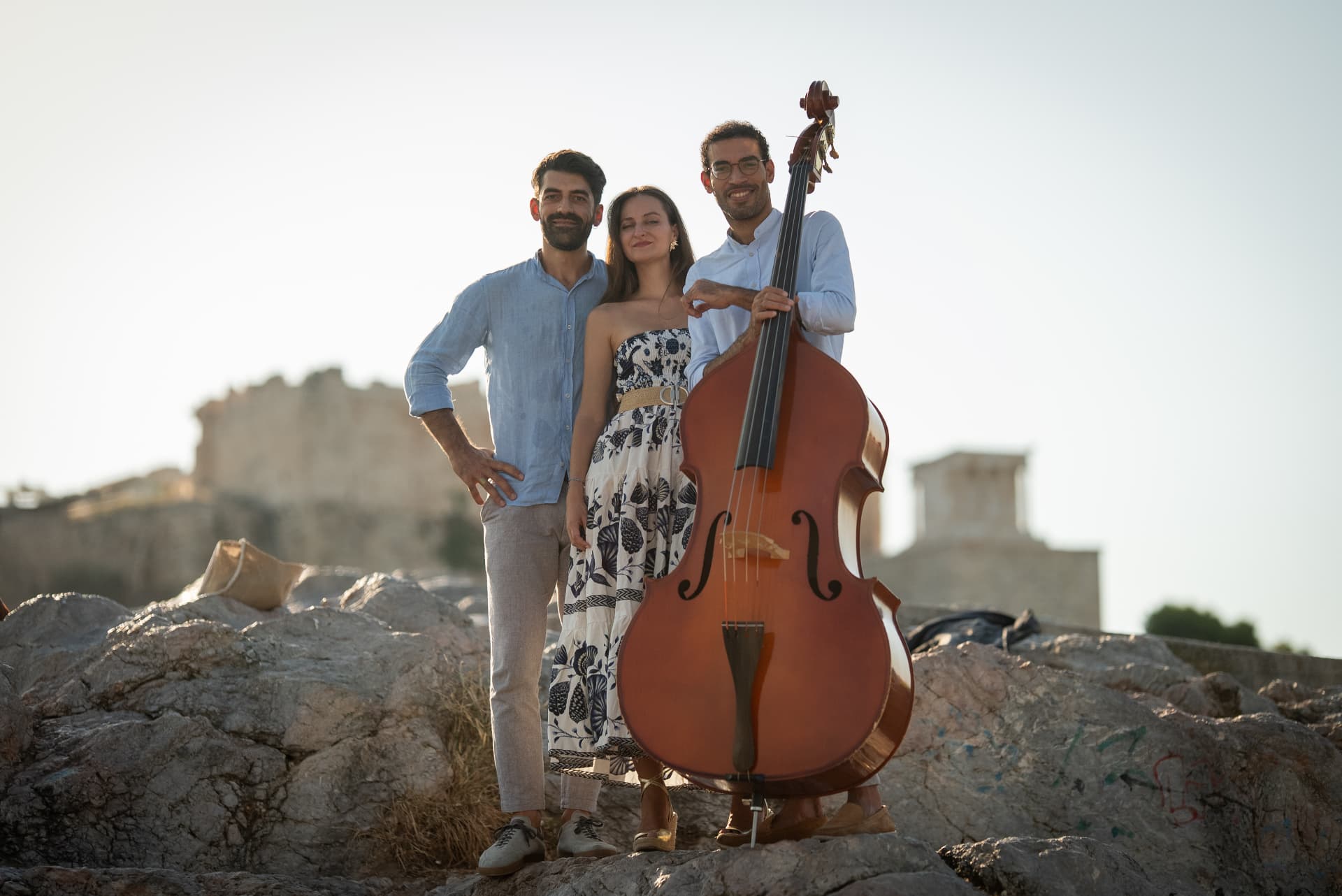 The trio on sunlit rocks at the Acropolis